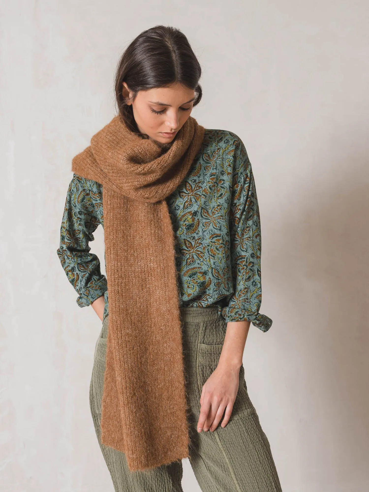 Sure! To optimize the title of an e-commerce product for INDI & COLD scarves, you want it to be descriptive, appealing, and include keywords that customers might use when searching for scarves. Heres a suggestion:

INDI & COLD Womens Soft Cashmere Blend Scarf - Stylish, Cozy, and Versatile Accessory

This title uses descriptive modifiers to highlight the material (Soft Cashmere Blend), the target audience (Womens), and key selling points (Stylish, Cozy, and Versatile Accessory).
